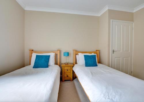 Postel nebo postele na pokoji v ubytování St Helens Apartment 2
