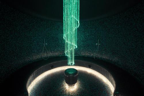 a string of green lights hanging from a ceiling at Les Terrasses d'Eze - Hôtel & Spa in Èze