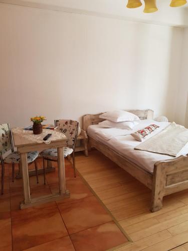 Кровать или кровати в номере Casa de Vacanta Razvan si Andrei