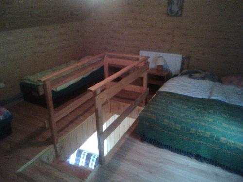 a bedroom with two bunk beds and a bed at Ośrodek Wczasowy "GRONOSTAJ" in Rajcza