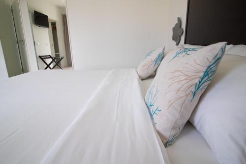 Un ou plusieurs lits dans un hébergement de l'établissement Hotel Dunas de Sal
