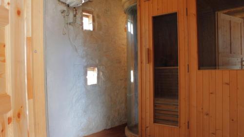 a room with a wall with two windows and a door at Siedlisko Kępina Zdrój in Ostrów