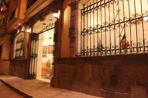 an entrance to a building with a wrought iron fence at Sol Plaza Hotel in Puno