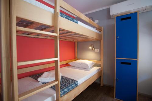 a bunk bed room with two bunk beds at Hostel Adriatic Piran in Piran