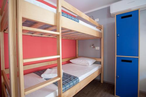 a bunk bed room with two bunk beds at Hostel Adriatic Piran in Piran