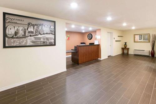 an empty lobby of a hospital with a pharmacyacistacistacistacistacist at Super 8 by Wyndham Duncan in Duncan