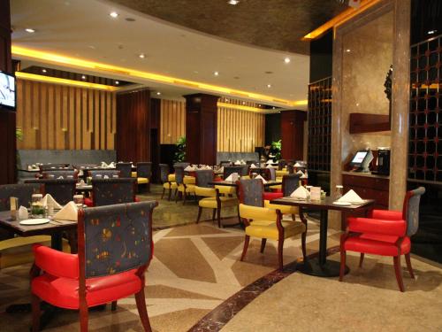 En restaurang eller annat matställe på The Pavilion Hotel Shenzhen (Huaqiang NorthBusiness Zone)