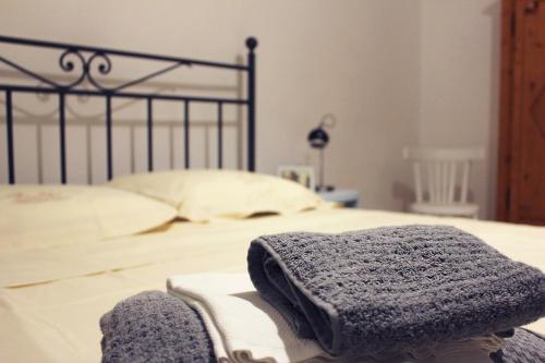 a close up of a bed with a towel on it at La Casetta Ferrara B&B in Ferrara