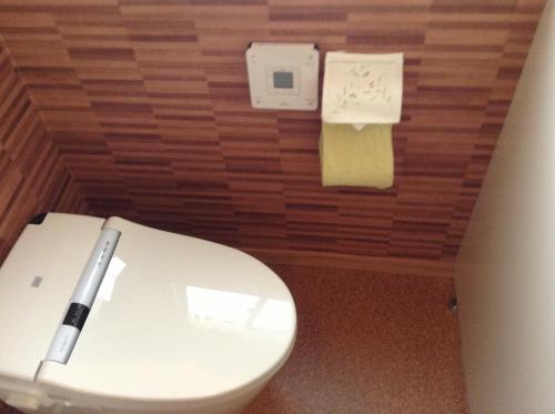 a bathroom with a white toilet and some paper at Miyasakaya in Nozawa Onsen