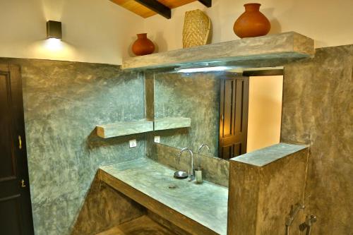a kitchen with a sink and a counter top at Blue Parrot Beach Villa in Ambalangoda