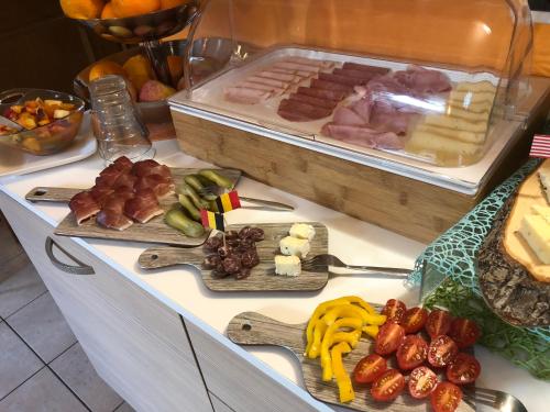 a buffet with different types of food on a table at Garni Villa Betty in Merano