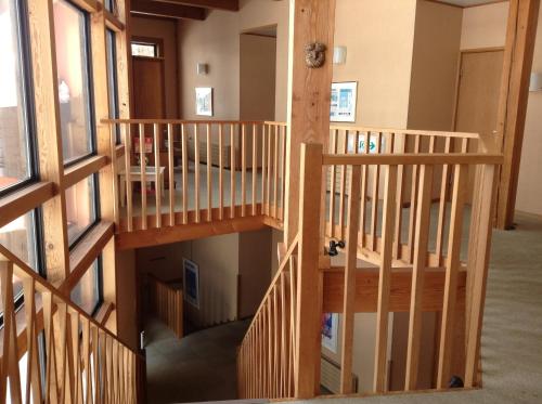 an overhead view of a wooden staircase in a house at Hakuba Alpine Hotel in Hakuba
