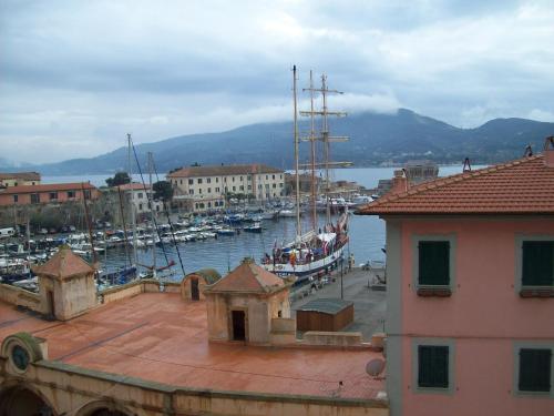a view of a harbor with boats in the water at Porta del Mare in Portoferraio