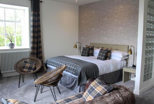 a bedroom with a bed and a couch at 1823 Spinning Block in Clitheroe