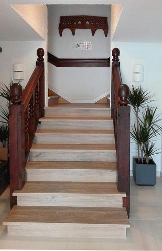 a staircase in a house with a stair case at Hostal Vista Alegre in Castro-Urdiales