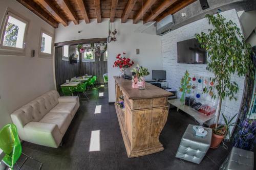 a living room with a couch and a table at A casa di V-Ale in Treviso