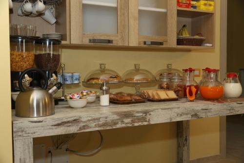a table with food and other items on it at BorgoPratole CountryHouse in Cingoli
