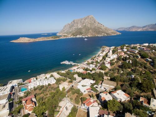 an aerial view of a small island in the water at Avra Studios in Myrties