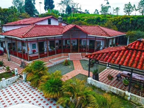 an aerial view of a house with a red roof at Finca Campestre La Adelita B&B in Salento