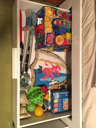 a shelf with toys and other toys on it at CHATA Privlaky in Přívlaky