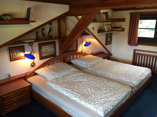 Postel nebo postele na pokoji v ubytování CHATA Privlaky