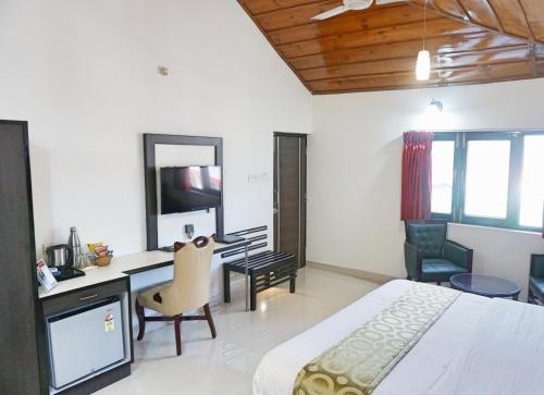 TV a/nebo společenská místnost v ubytování Ess & Bee Resorts