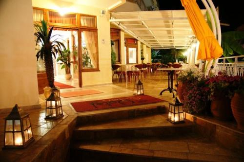 a lobby of a house with lights on the floor at Hotel Eden in Nei Poroi