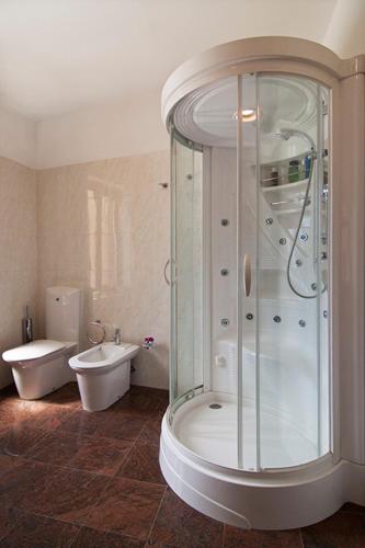a bathroom with a shower and a toilet and a sink at Pula Citybreak in Pula