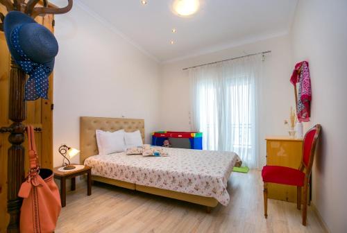 Tempat tidur dalam kamar di Kallisti Apartment