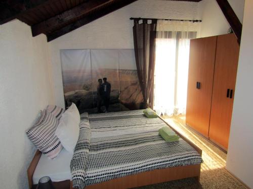 Postel nebo postele na pokoji v ubytování Apartmani Lovro