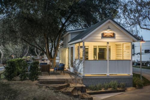 a small house with a light on the front of it at Flying Flags RV Resort & Campground in Buellton