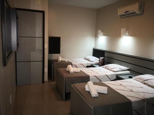 Cama ou camas em um quarto em Brasilia Parque Hotel