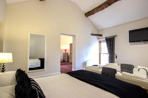 Ένα ή περισσότερα κρεβάτια σε δωμάτιο στο The Badger Inn