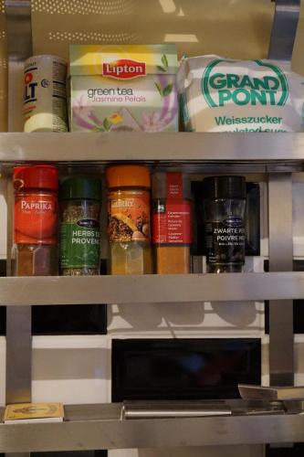 a shelf filled with different types of food at Studio Rempart in Brussels