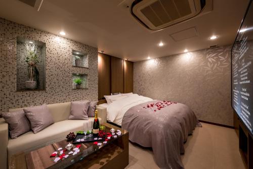 Una cama o camas en una habitación de Restay Onoji (Adult Only)