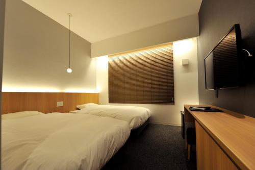 Voodi või voodid majutusasutuse FUGASTAY Shijo Omiya toas