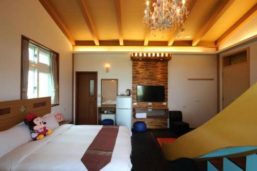 Postel nebo postele na pokoji v ubytování Mei Man Slide Homestay