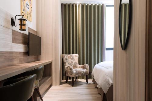 Postel nebo postele na pokoji v ubytování Tianli Hotel