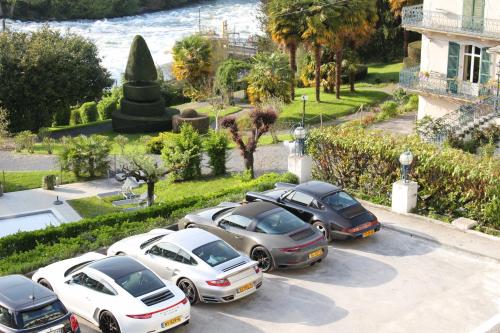 a group of cars parked in a parking lot at Belfry & Spa by Ligne St Barth in Lourdes