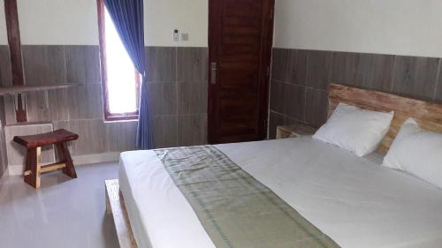 Кровать или кровати в номере Telagamas Guest House
