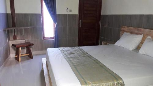 Кровать или кровати в номере Telagamas Guest House