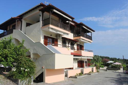 a large building with balconies on the side of it at House Panorama Sea View in Neos Marmaras