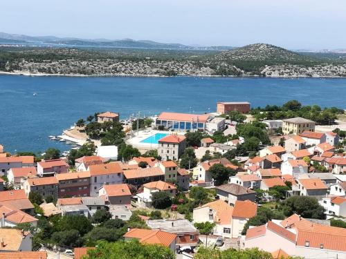 an aerial view of a town next to the water at Apartman Betty in Šibenik