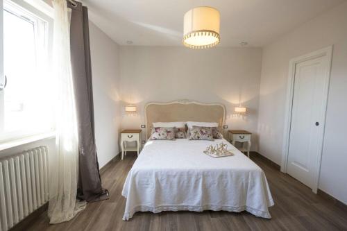 Postel nebo postele na pokoji v ubytování Santa Lucia B&B