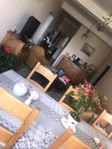 an aerial view of a living room with a table and chairs at A Balamata in Cervione