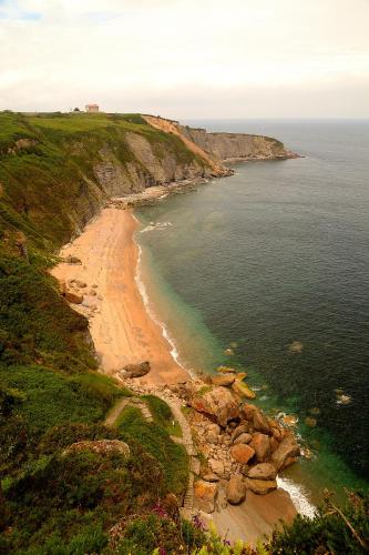 an aerial view of a beach and the ocean at La Colina in Gijón