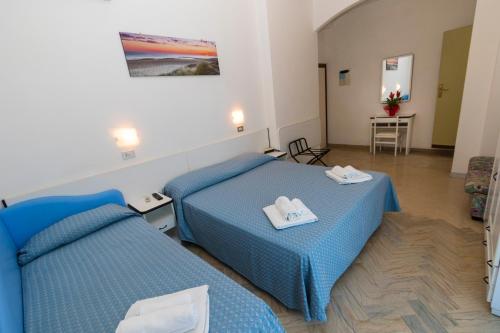 Postel nebo postele na pokoji v ubytování Hotel Tre Assi
