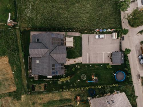an overhead view of a house with a yard at eco boutique hotel AMS Beagle in Bled