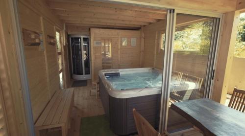 a jacuzzi tub in a tiny house at Rooms Maison 3 Magnoni in Trieste