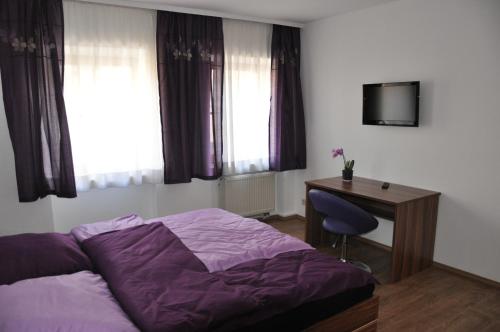 Postel nebo postele na pokoji v ubytování Gästezimmer Michelangelo